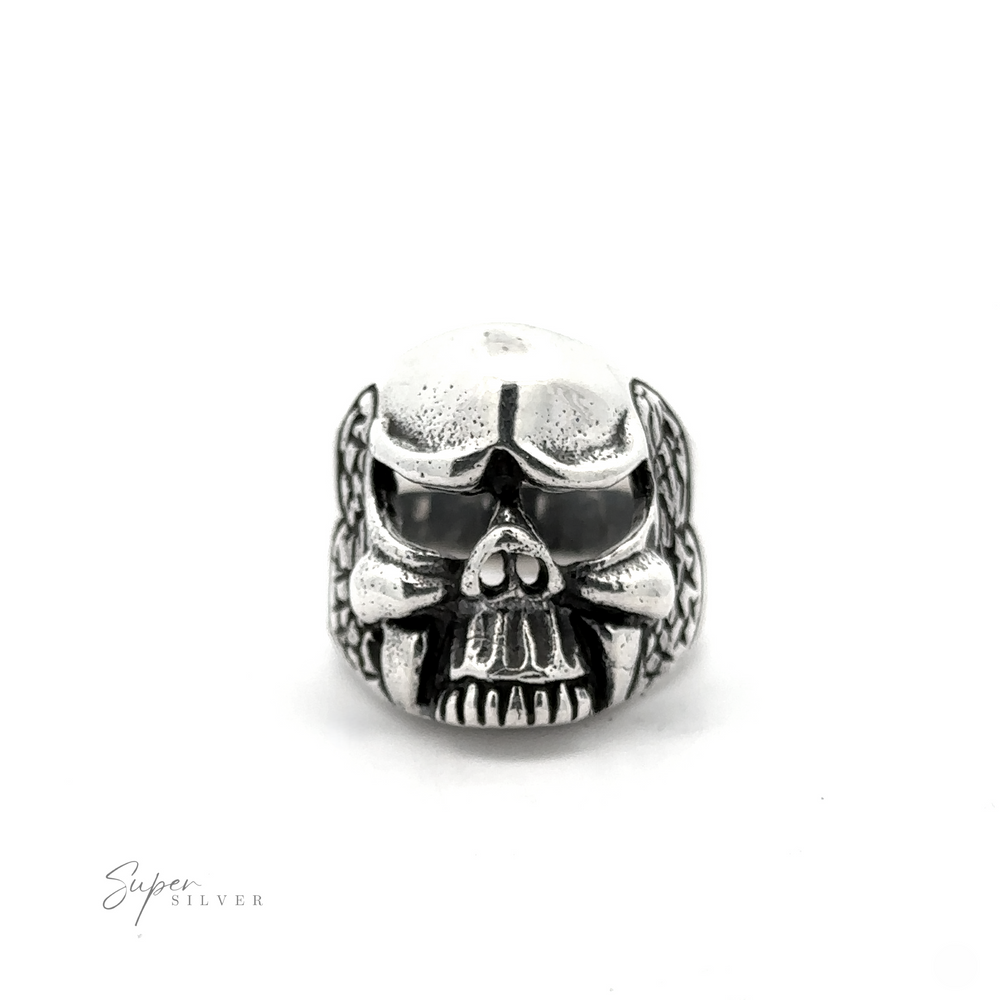 
                  
                    The Skull Statement Ring, crafted from .925 Sterling Silver, features a skull design with intricate engravings. Ideal for an edgy look, it showcases darkened areas that accentuate the eyes, nose, and mouth. The brand name "Super Silver" is printed in the bottom left corner.
                  
                