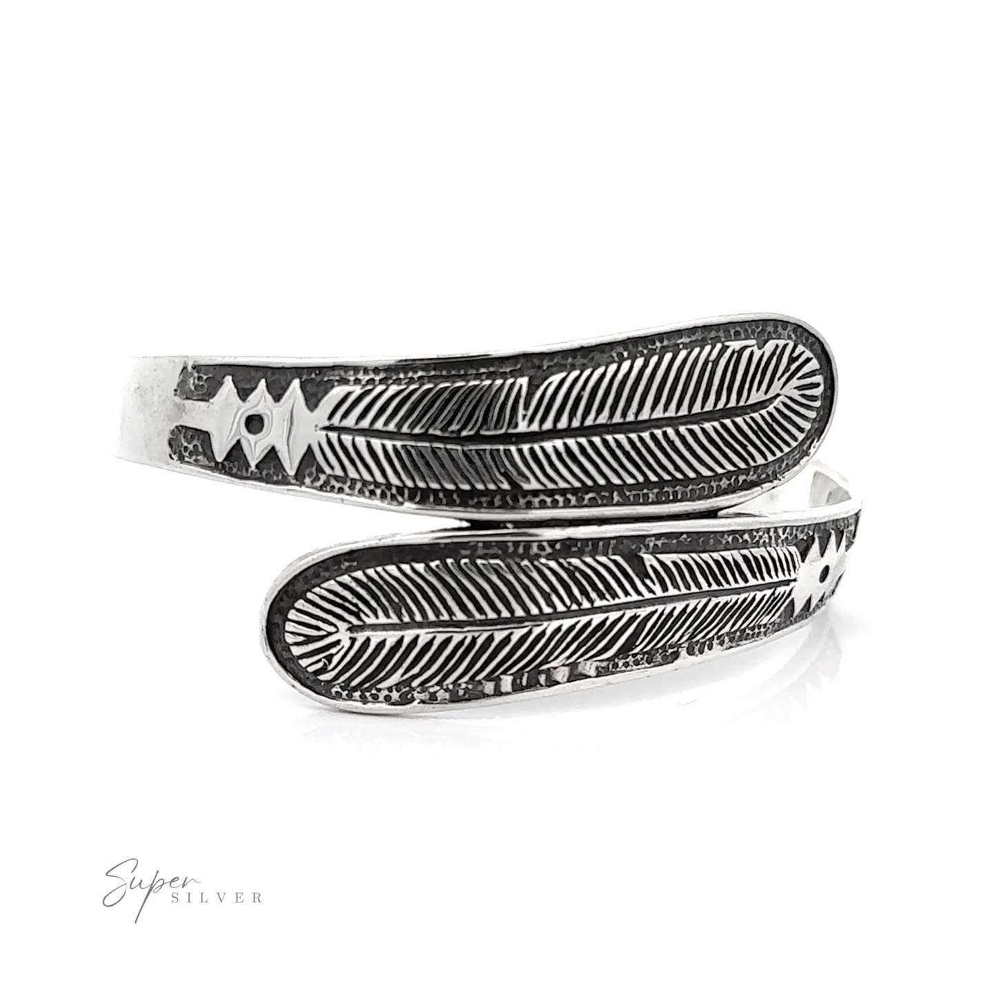 A pair of Double Feather Cuff bracelets with an oxidized finish.