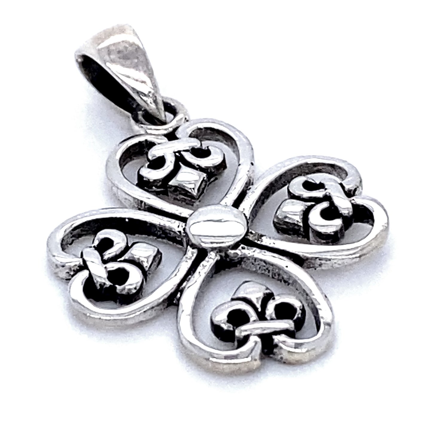 
                  
                    A Clover Cross Pendant with Fleur De Lis in the shape of a clover with intricate heart designs in the petals, exuding a vintage style.
                  
                