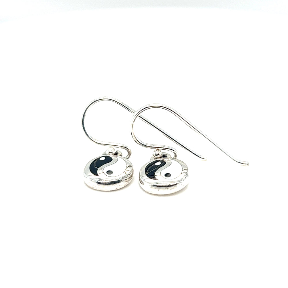 
                  
                    A pair of Round Yin-Yang Dangle Earrings against a white background.
                  
                