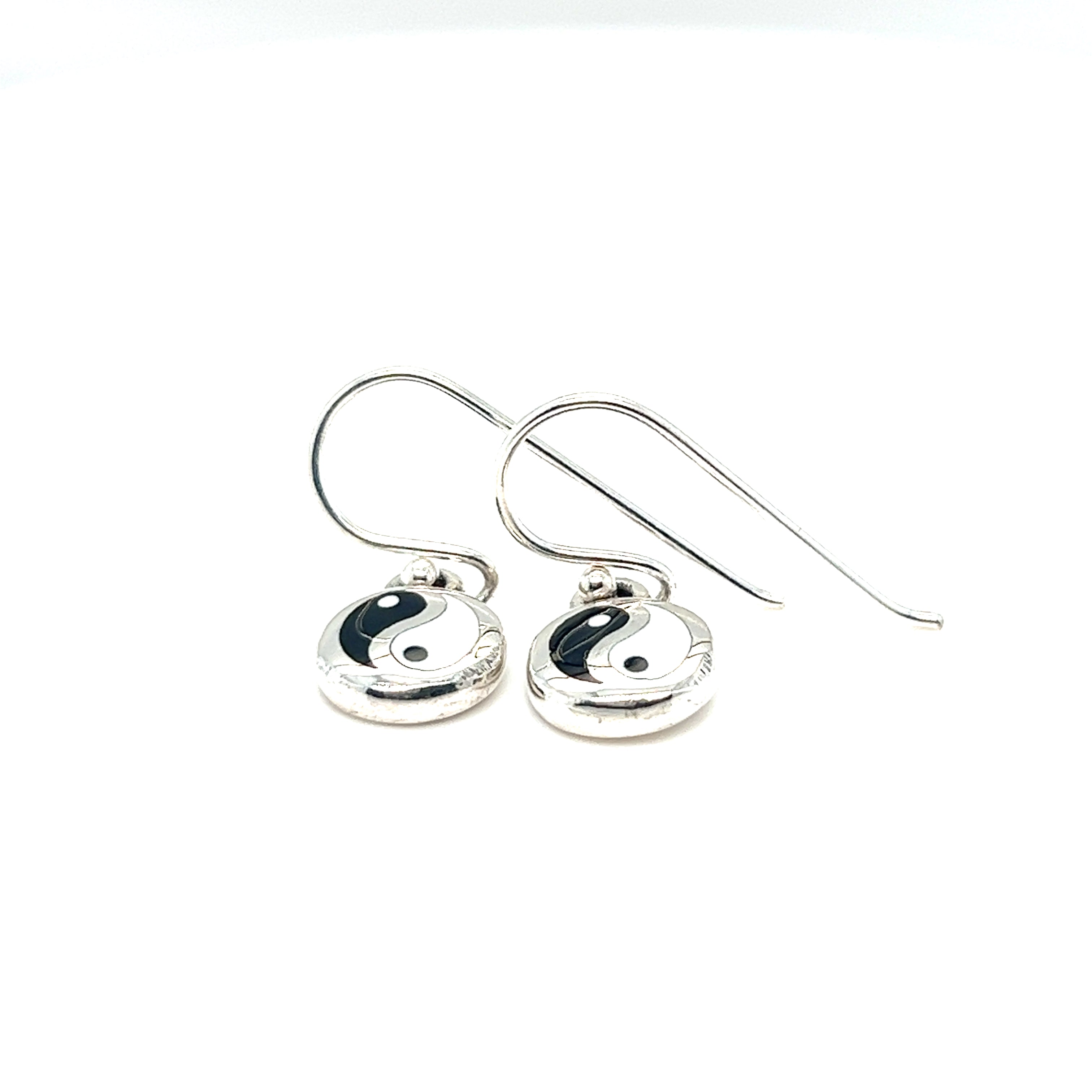 A pair of Round Yin-Yang Dangle Earrings against a white background.