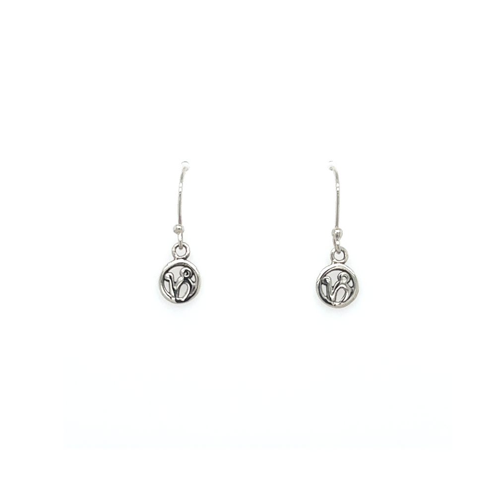
                  
                    A pair of Super Silver Capricorn Zodiac Earrings with a small coin featuring the Capricorn zodiac symbol.
                  
                