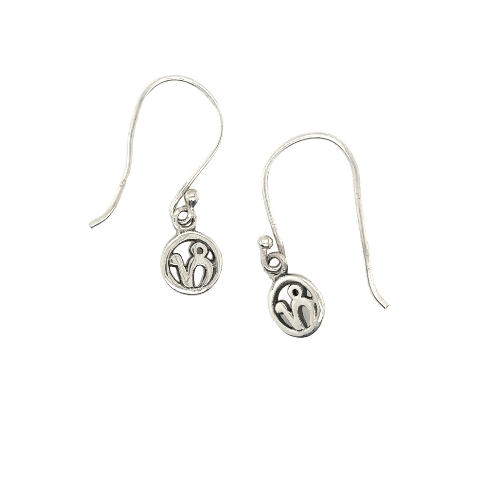 A pair of Capricorn Zodiac Earrings by Super Silver, with a heart on them.