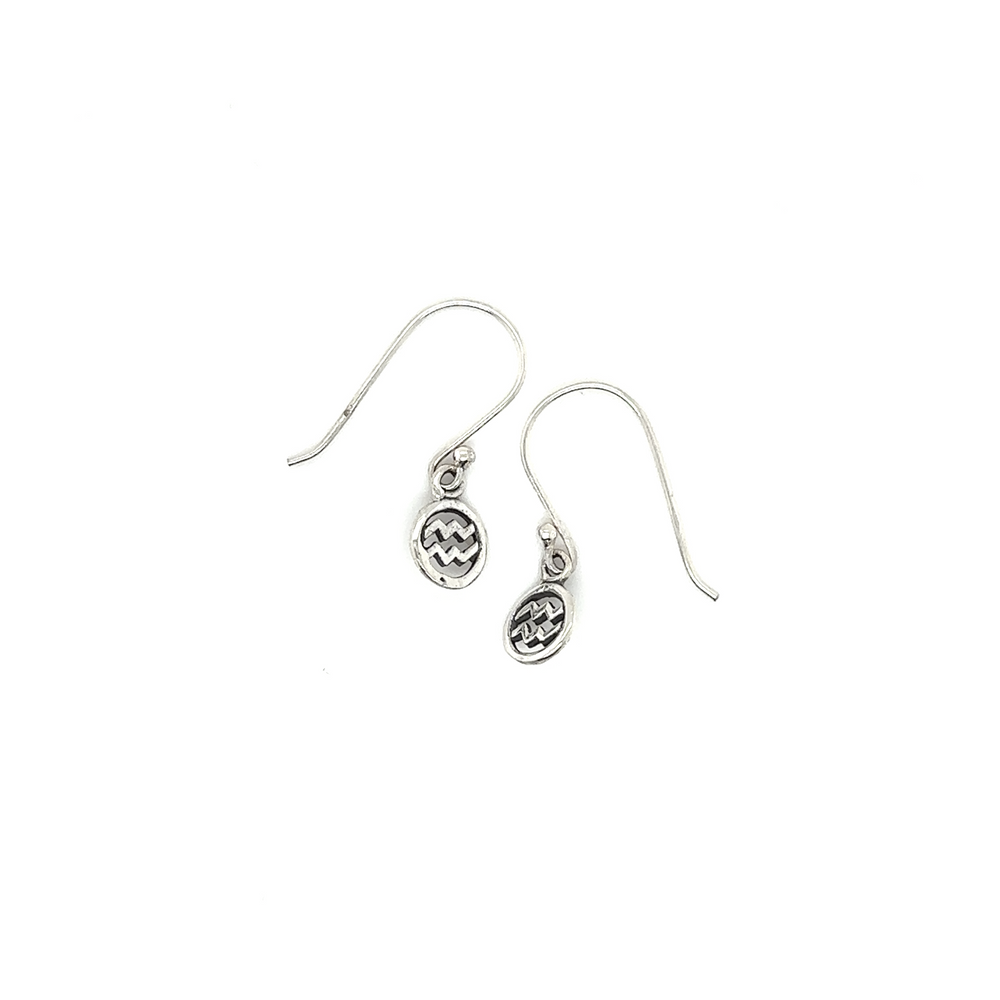 
                  
                    A pair of Aquarius Zodiac Earrings made from sterling silver by Super Silver.
                  
                