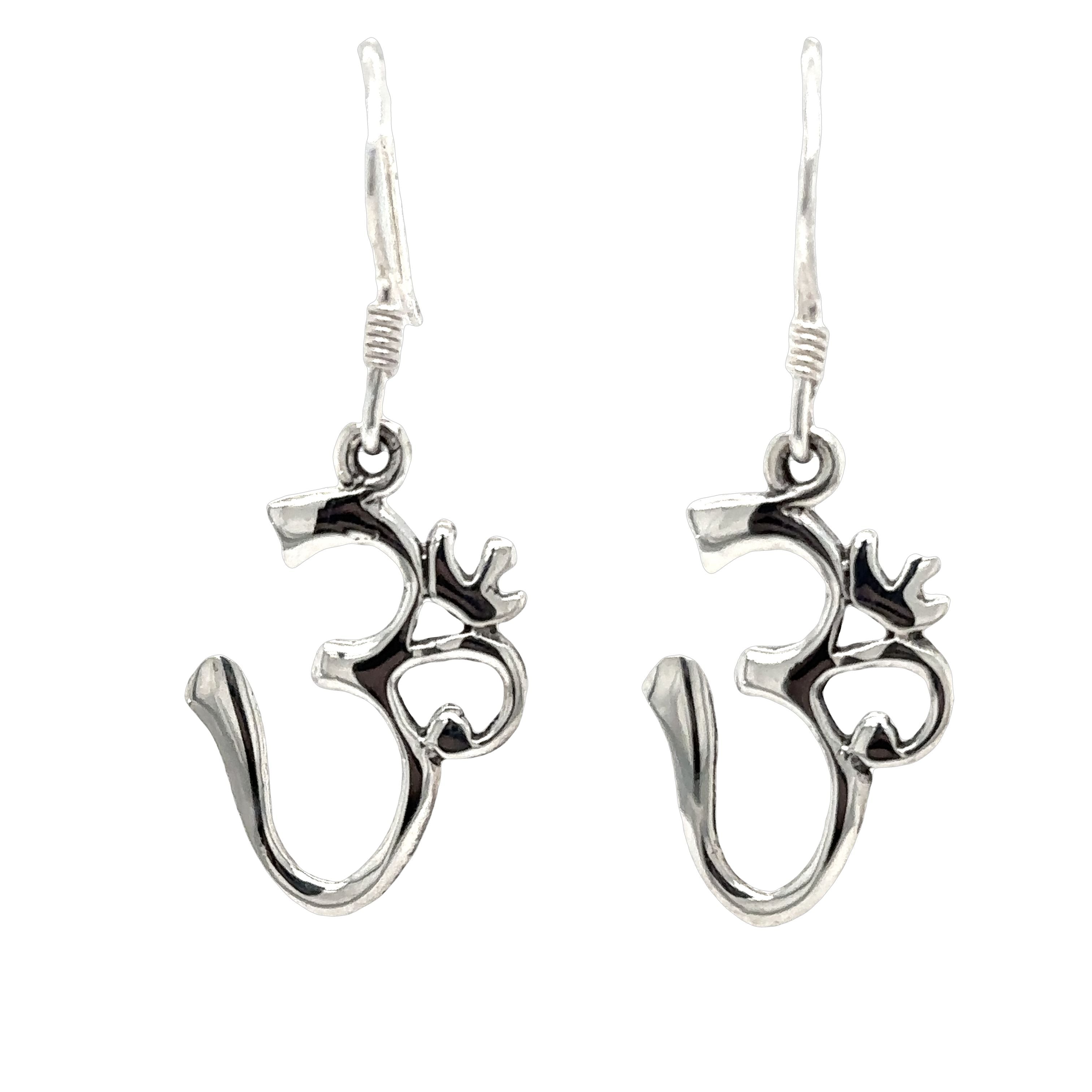 A pair of Simple Om Earrings by Super Silver on a white background.