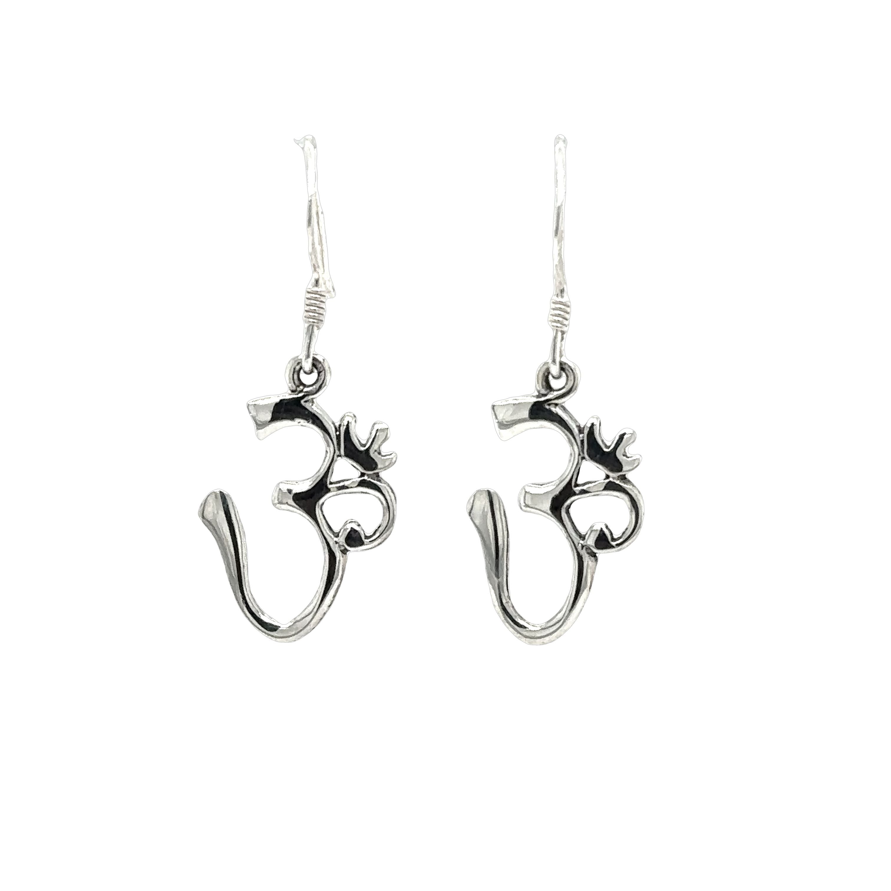 A pair of Super Silver Simple Om Earrings on a white background.