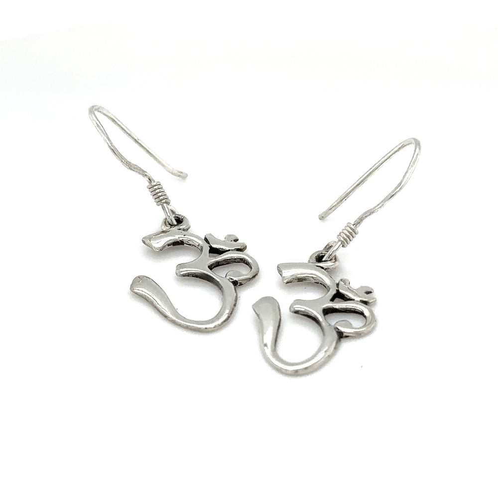 
                  
                    A pair of Simple Om Earrings by Super Silver on a white background.
                  
                