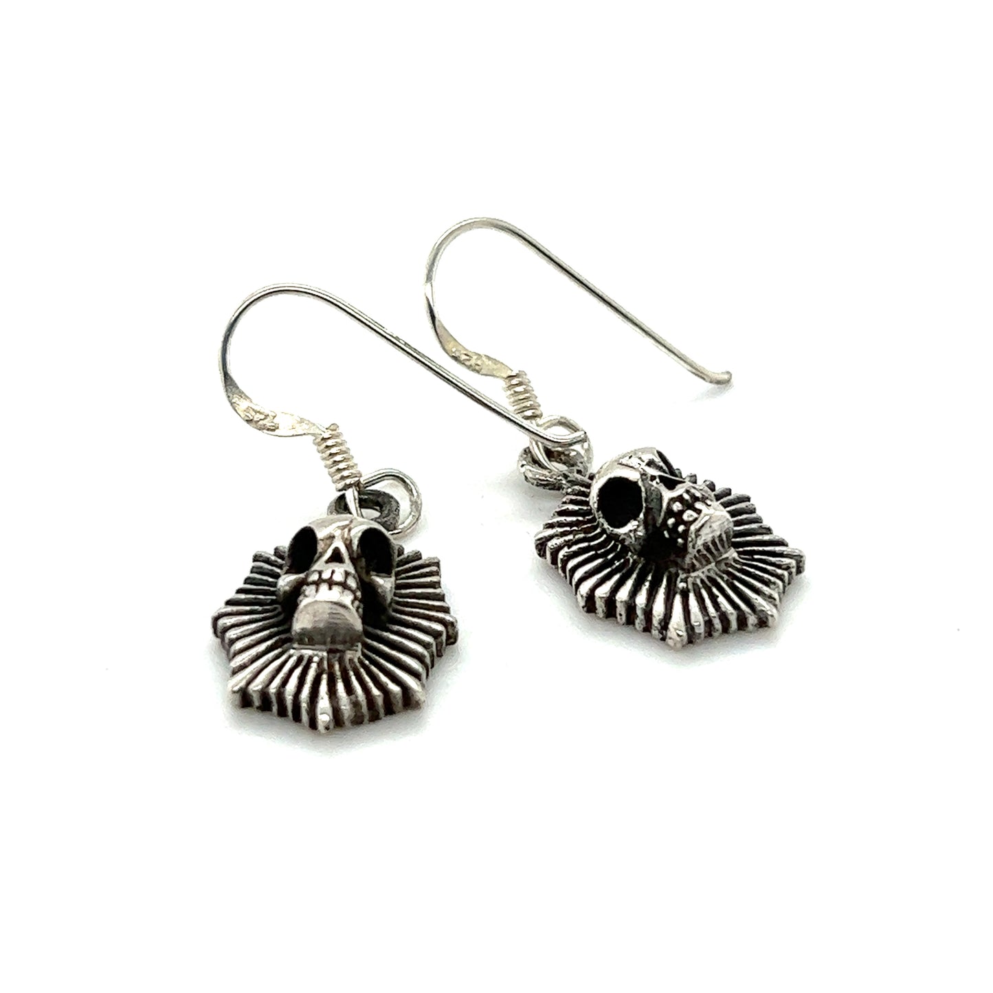A pair of Radiant Skull earrings by Super Silver, exuding a sense of mystique.