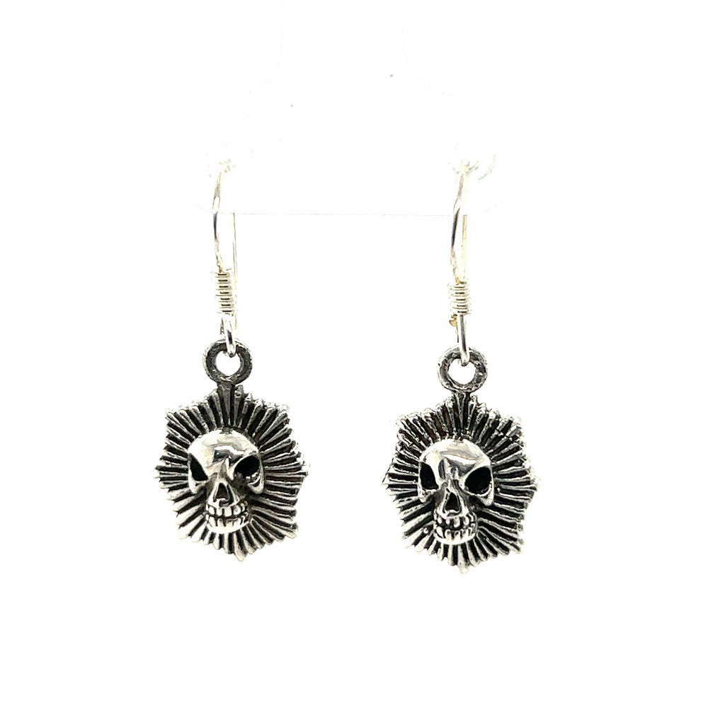 These Radiant Skull Earrings by Super Silver feature a skull and sunburst design, combining edgy and elegant elements.