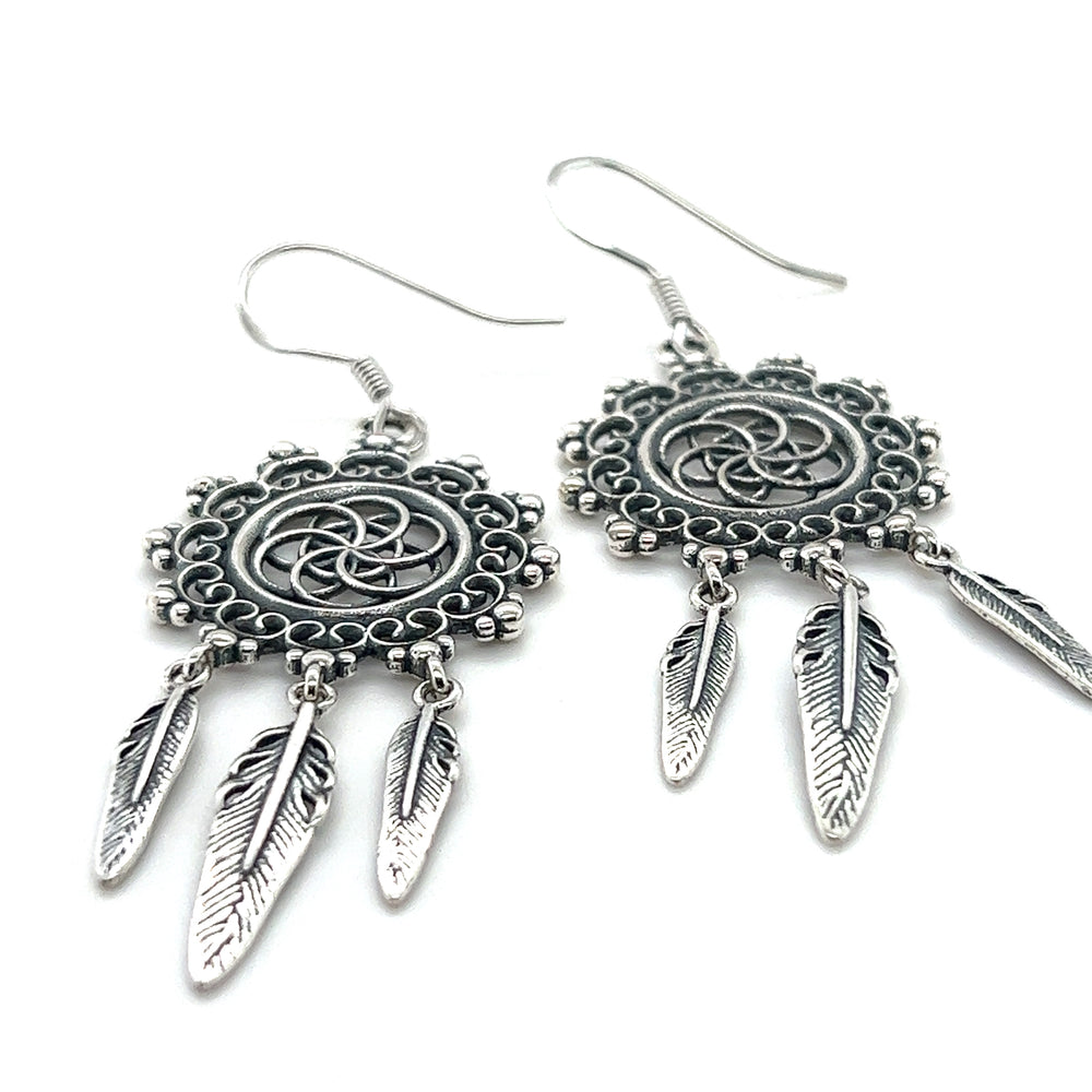 
                  
                    A pair of Super Silver Dreamcatcher Earrings With The Flower Of Life Symbol, perfect for those embracing the bohemian spirit.
                  
                