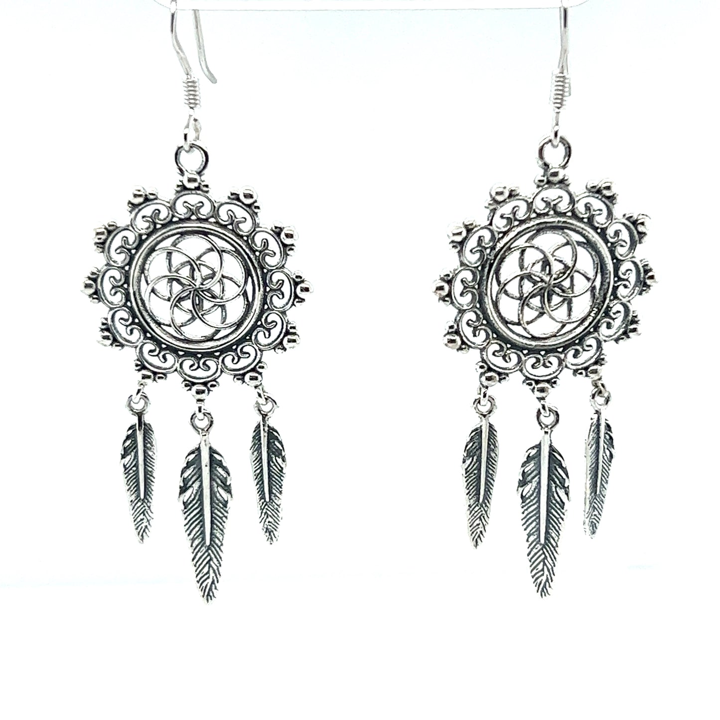 
                  
                    A pair of Super Silver bohemian silver Dreamcatcher Earrings with the Flower of Life Symbol and feathers.
                  
                