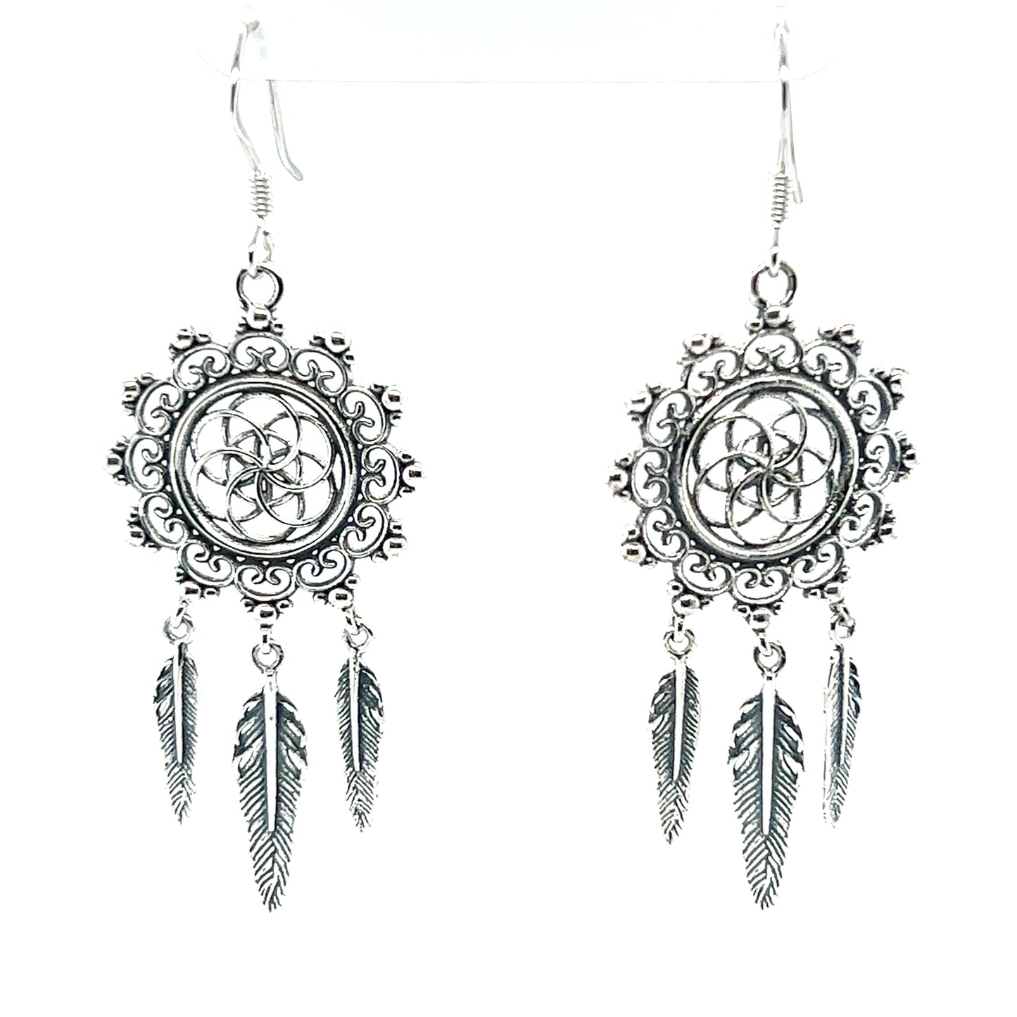 A pair of Super Silver Dreamcatcher Earrings With The Flower Of Life Symbol, perfect for the bohemian souls who appreciate sacred geometry.