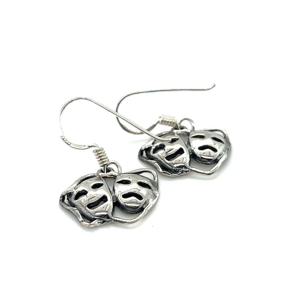 
                  
                    A stylish pair of Super Silver Smile Now Cry Later earrings featuring a minimalist design with two faces on them.
                  
                