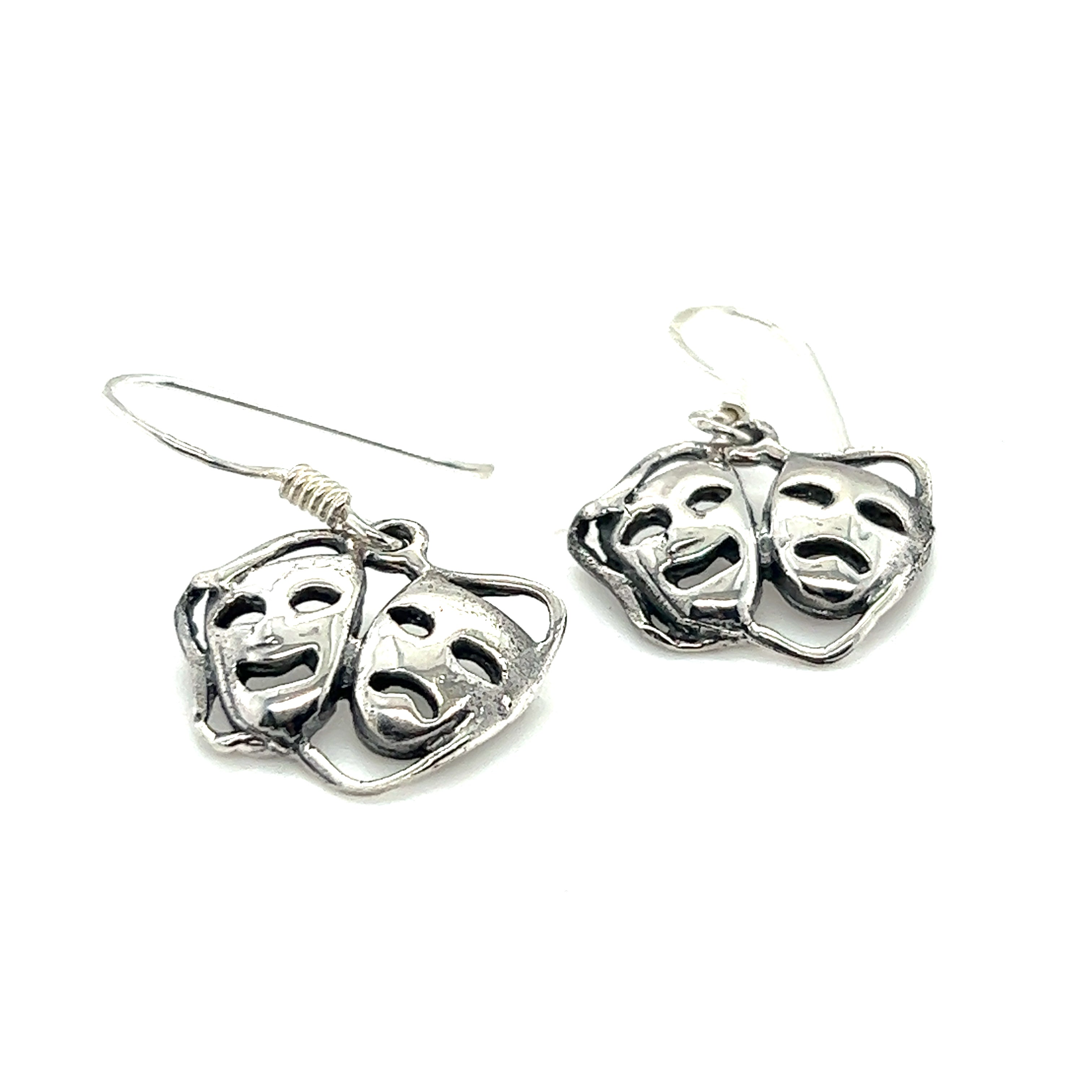 A minimalist design of Super Silver Smile Now Cry Later earrings on a white background.