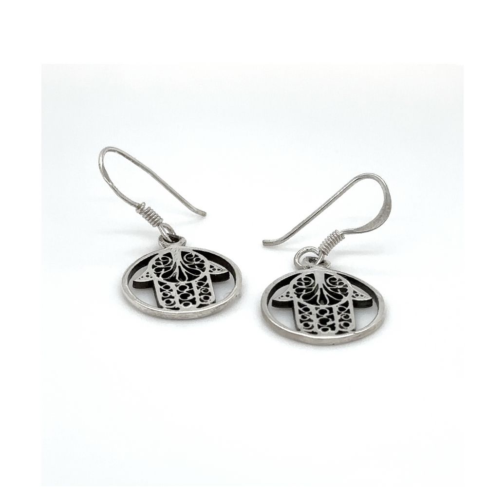 
                  
                    A pair of Hamsa Hand In Open Circle Earrings by Super Silver with an image of an owl on them.
                  
                