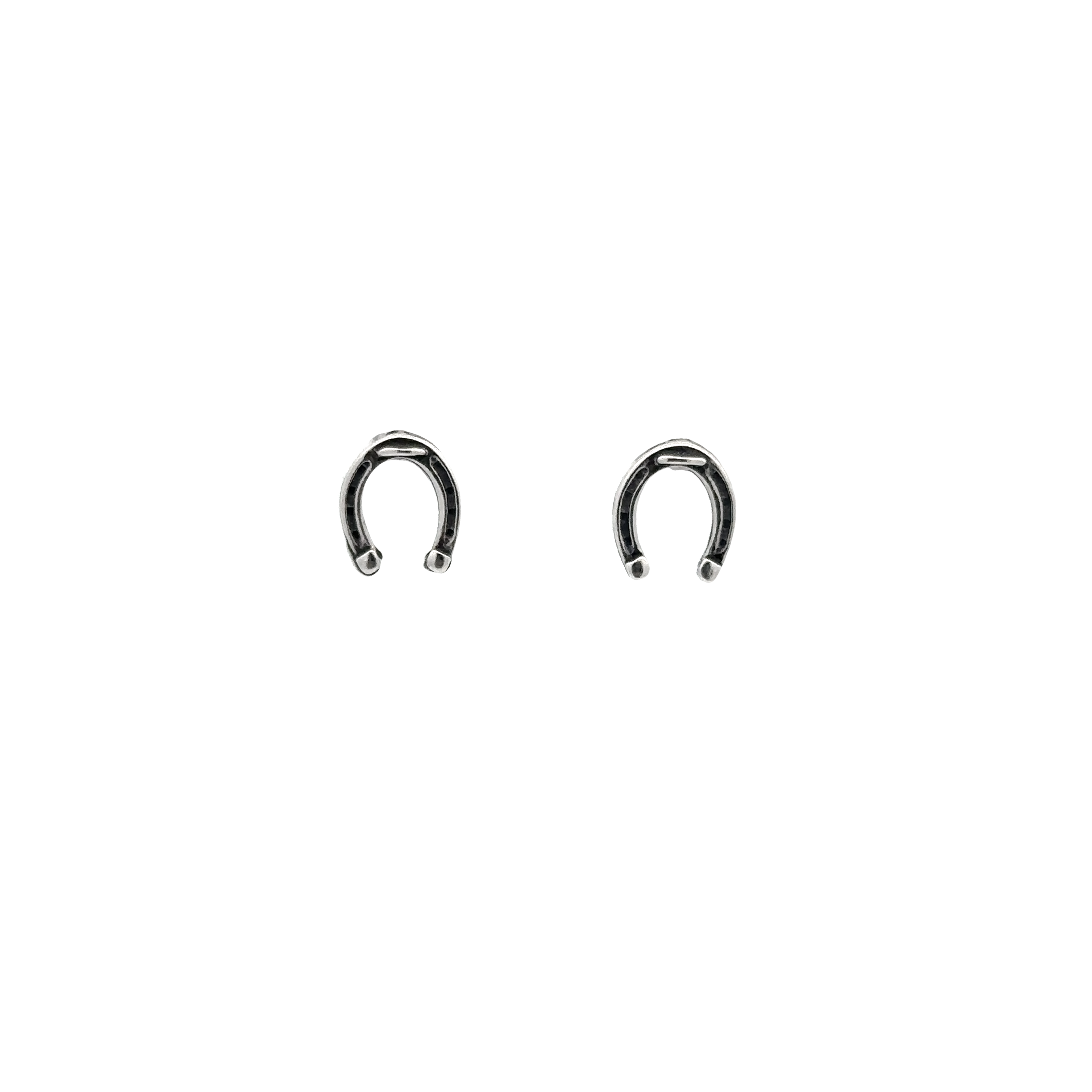 A pair of Horseshoe Studs on a white background, crafted from .925 Sterling Silver for extra luck.