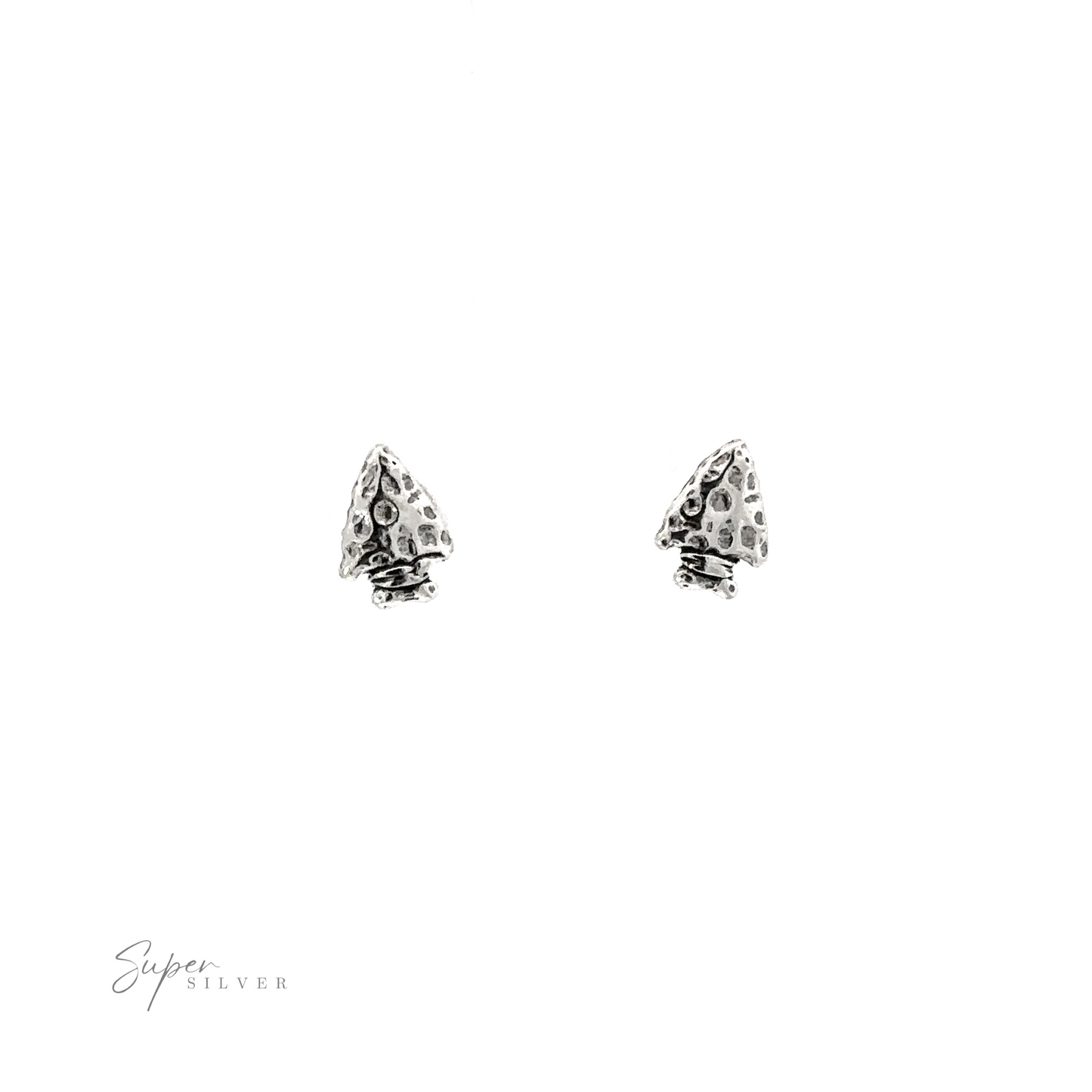 A pair of Arrowhead Studs with a detailed texture on a white background.