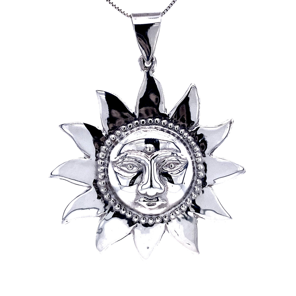 
                  
                    A stunning Sun God Pendant, intricately designed with detailed facial features, hangs gracefully from a matching chain.
                  
                