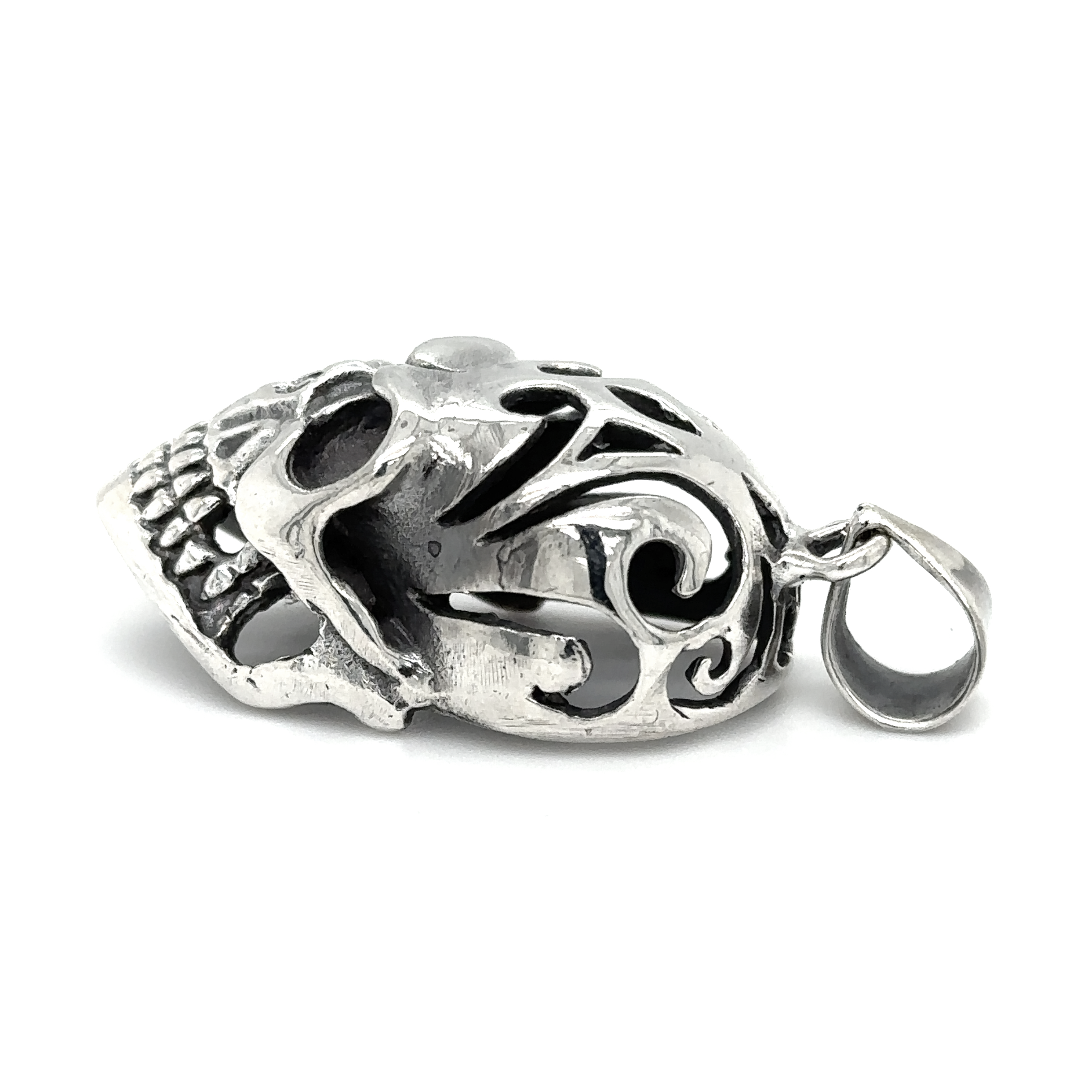 A distinctive Super Silver skull pendant with an oxidized finish on a white background.