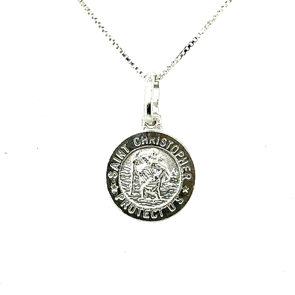 
                  
                    Super Silver's Saint Christopher Medallion In Various Sizes, a sterling silver medal.
                  
                