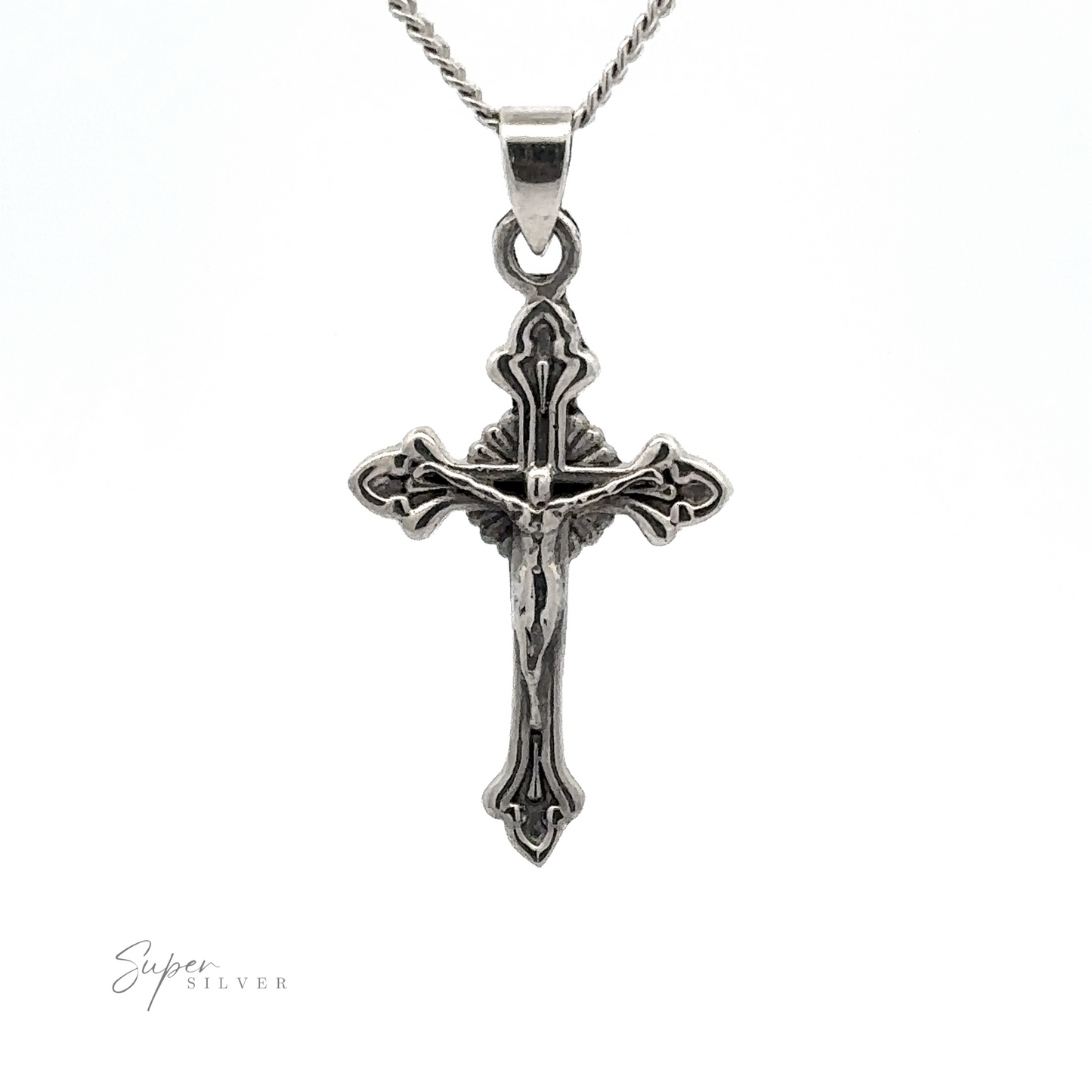 
                  
                    A detailed Crucifix Charm on a chain, with intricate designs and a figure in the center. The background is plain white.
                  
                