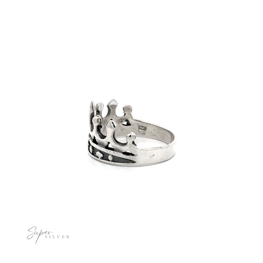 
                  
                    A graceful Crown Ring on a white background.
                  
                