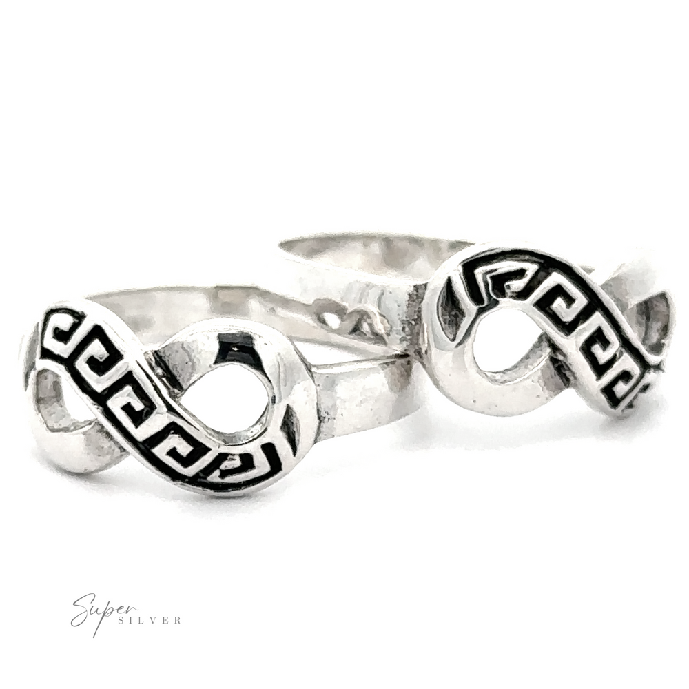 Two Infinity Rings with Greek Key Design. A subtle Greek Key design complements the infinity symbol. The logo 