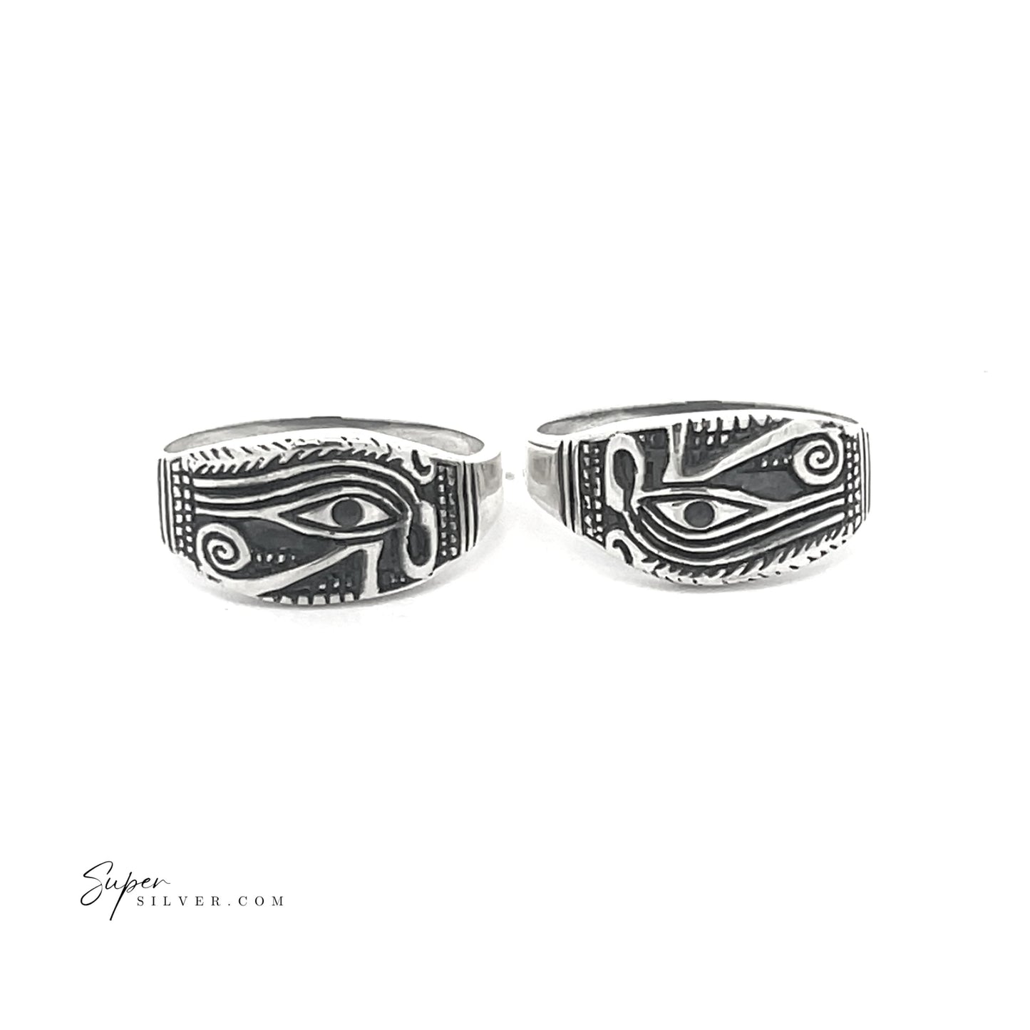 A pair of striking Eye of Ra rings gleam against a white background, each crafted in sterling silver. The oxidized finish highlights the intricate details of the Eye of Horus design beautifully.