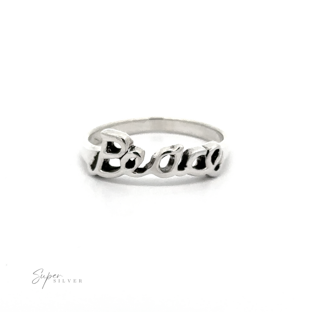 
                  
                    A sterling silver band with the word 'Peace' engraved in cursive writing.
                  
                