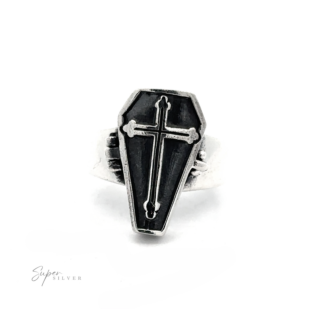 
                  
                    The Poison Coffin Ring with Cross is a .925 Sterling Silver ring that exudes gothic elegance with its coffin-shaped face. It prominently features a cross at the center, set against a white background, while the words "Super Silver" are visible in the lower left corner.
                  
                