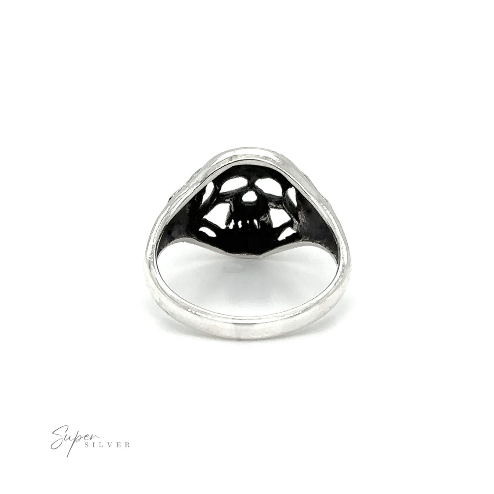 
                  
                    A gothic Smaller Skull Ring with black and white designs.
                  
                