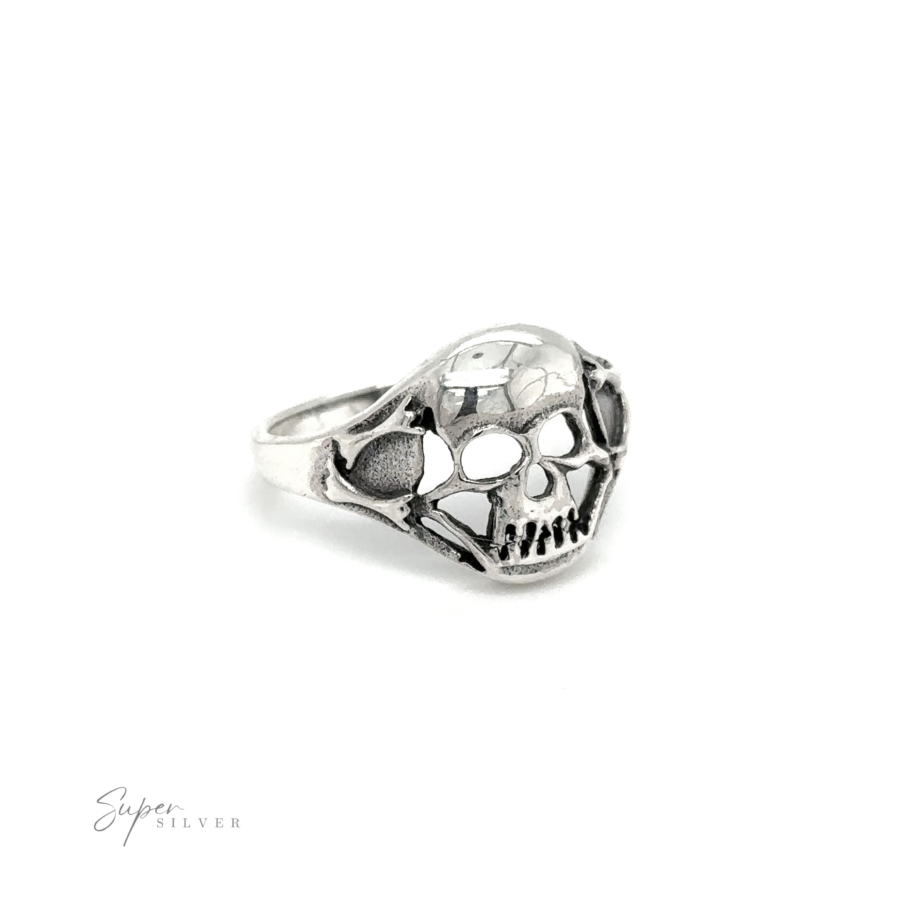 A gothic sterling silver smaller skull ring glimmers against a crisp white background.
