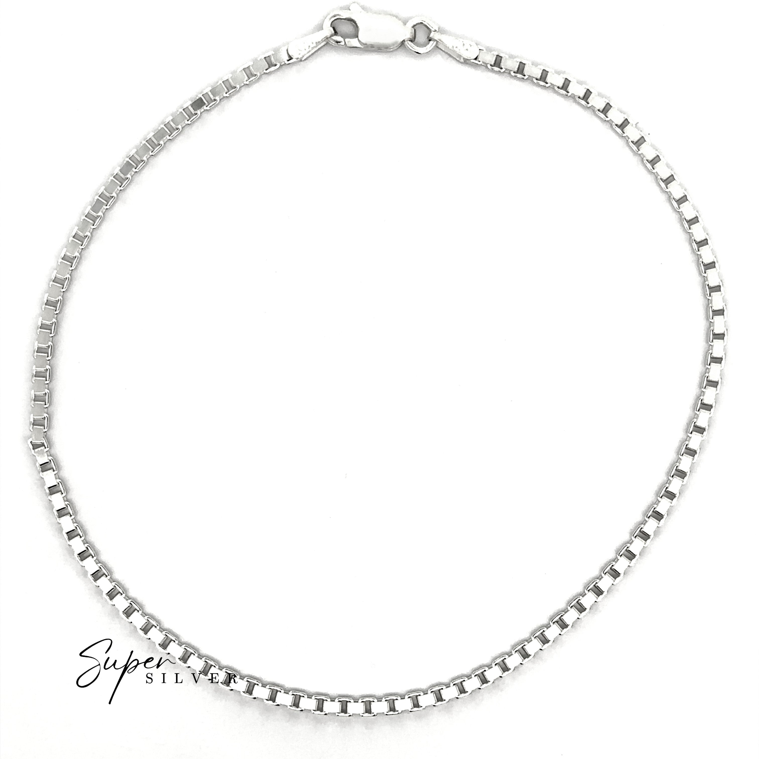 A Bold Italian Box Chain in sterling silver with a lobster clasp, displayed in a circle on a white background. "Super Silver" is written at the bottom left, emphasizing the minimalist style of this Italian necklace.