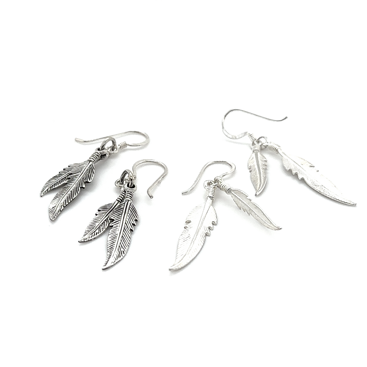 
                  
                    Three Super Silver Double Feather Earrings on a white background.
                  
                
