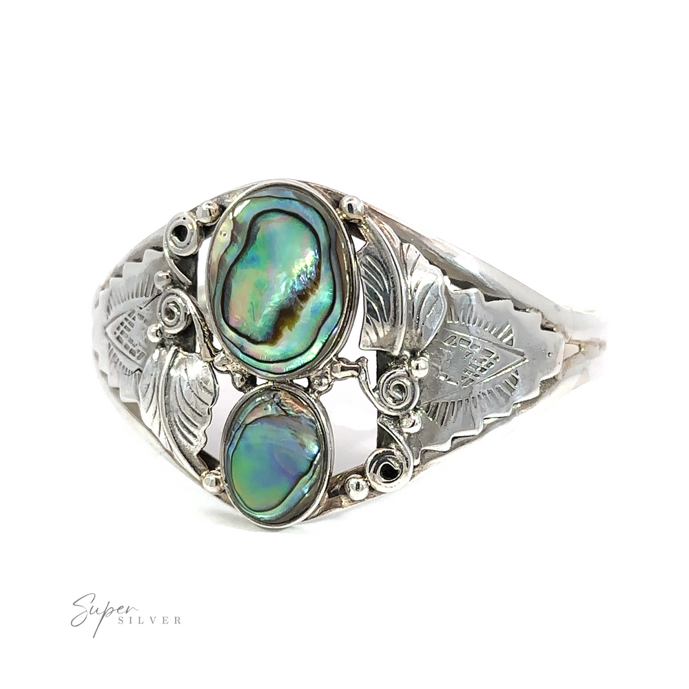 
                  
                    A sterling silver ring adorned with an Abalone Two Ovals with Flowers Bracelet.
                  
                