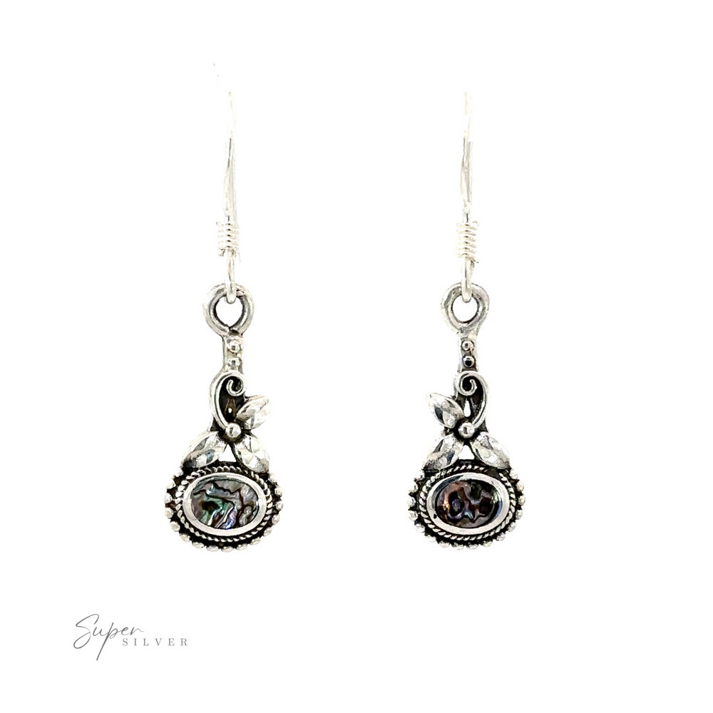 A pair of Inlaid Flower Earrings with Oval Stone, exuding boho elegance.