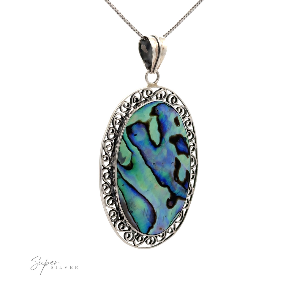 A sterling silver necklace with a large **Oval Abalone Pendant with filigree border** featuring an iridescent blue and green shell and intricate silver detailing around the edges.