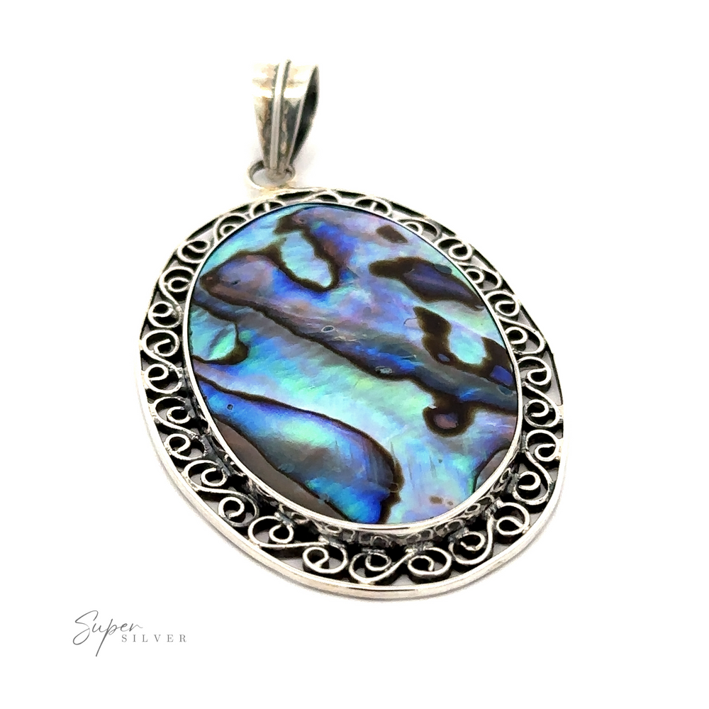 A Oval Abalone Pendant with filigree border featuring an oval abalone shell with blue and purple hues, surrounded by an intricate filigree setting. The word "Super Silver" is visible in the bottom left corner.
