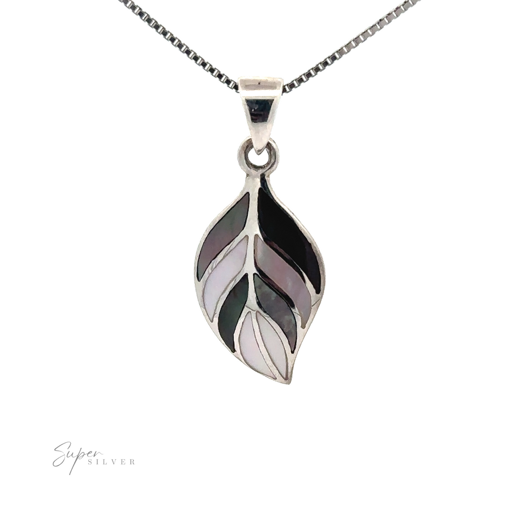 
                  
                    Stone Inlaid Leaf Pendant, featuring segments of black, white, and soft pink inlay. The image has a white background with the text "Super Silver" in the lower left corner.
                  
                