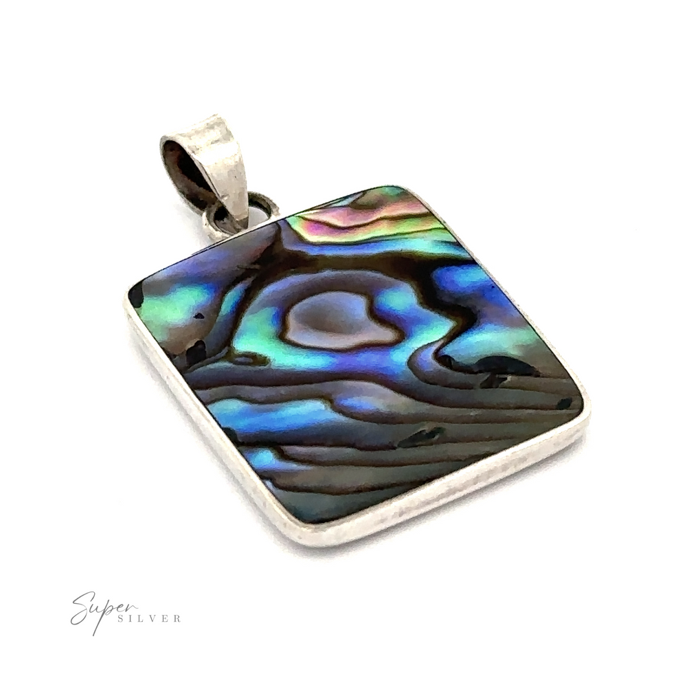 
                  
                    The Square Abalone Pendant, featuring a sterling silver frame that showcases iridescent blue, green, and purple hues, exudes a beachy charm against a white background.
                  
                