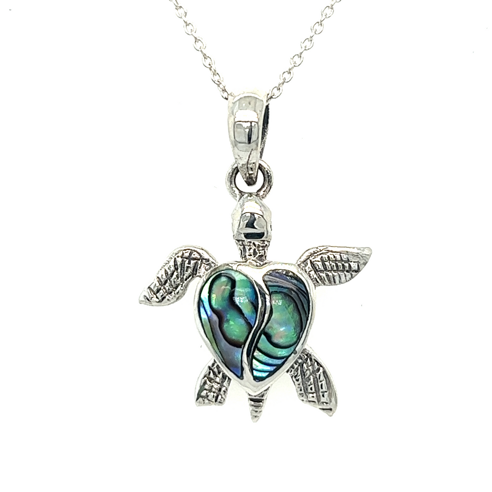 A Stone Inlay Turtle Pendant with a heart shaped shell.
