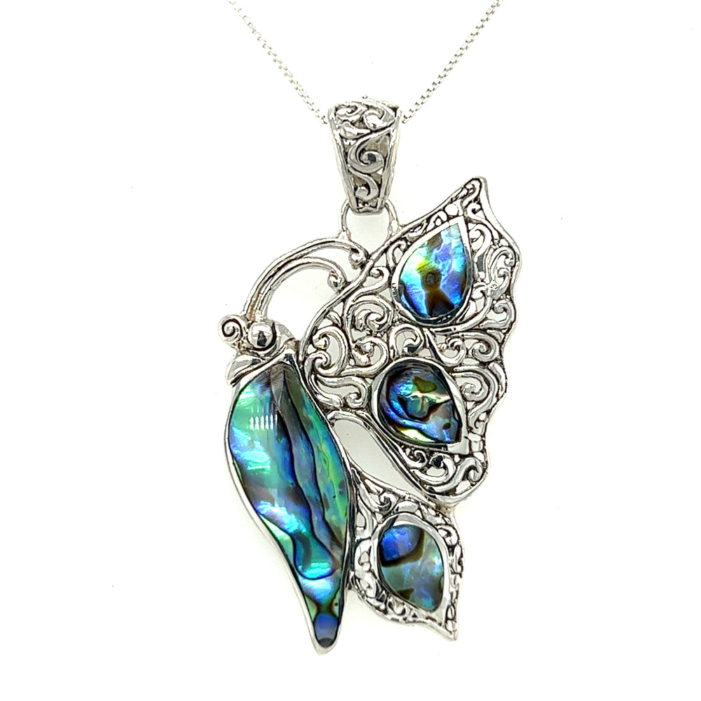 
                  
                    A Filigree Butterfly Inlay Pendant on a silver chain, symbolizing transformation.
                  
                