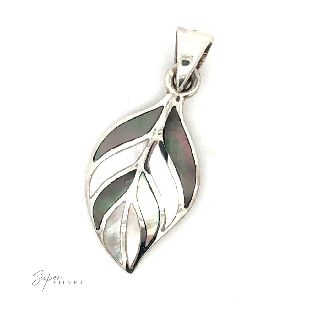 
                  
                    Stone Inlaid Leaf Pendant with intricate cut-out details and inlaid abalone shell patterns against a plain white background. The word "Super Silver" is visible in the bottom left corner, capturing the essence of a dainty Stone Inlaid Leaf Pendant.
                  
                