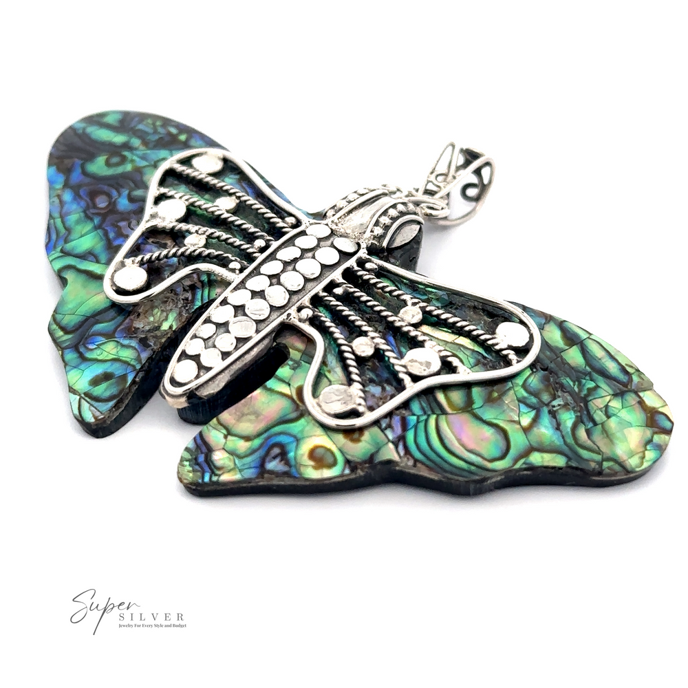 A Large Abalone Butterfly Pendant with intricate silver detailing and vibrant, multicolored wings made of abalone shell is set against a plain white background. Text in the image reads 