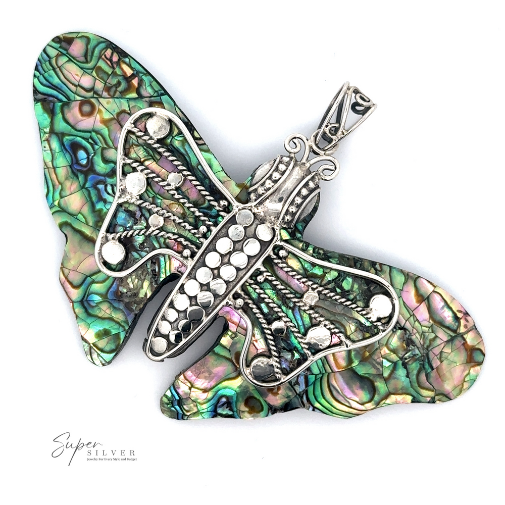 
                  
                    A Large Abalone Butterfly Pendant featuring intricate silver detailing and colorful shell inlays, known for its healing properties.
                  
                