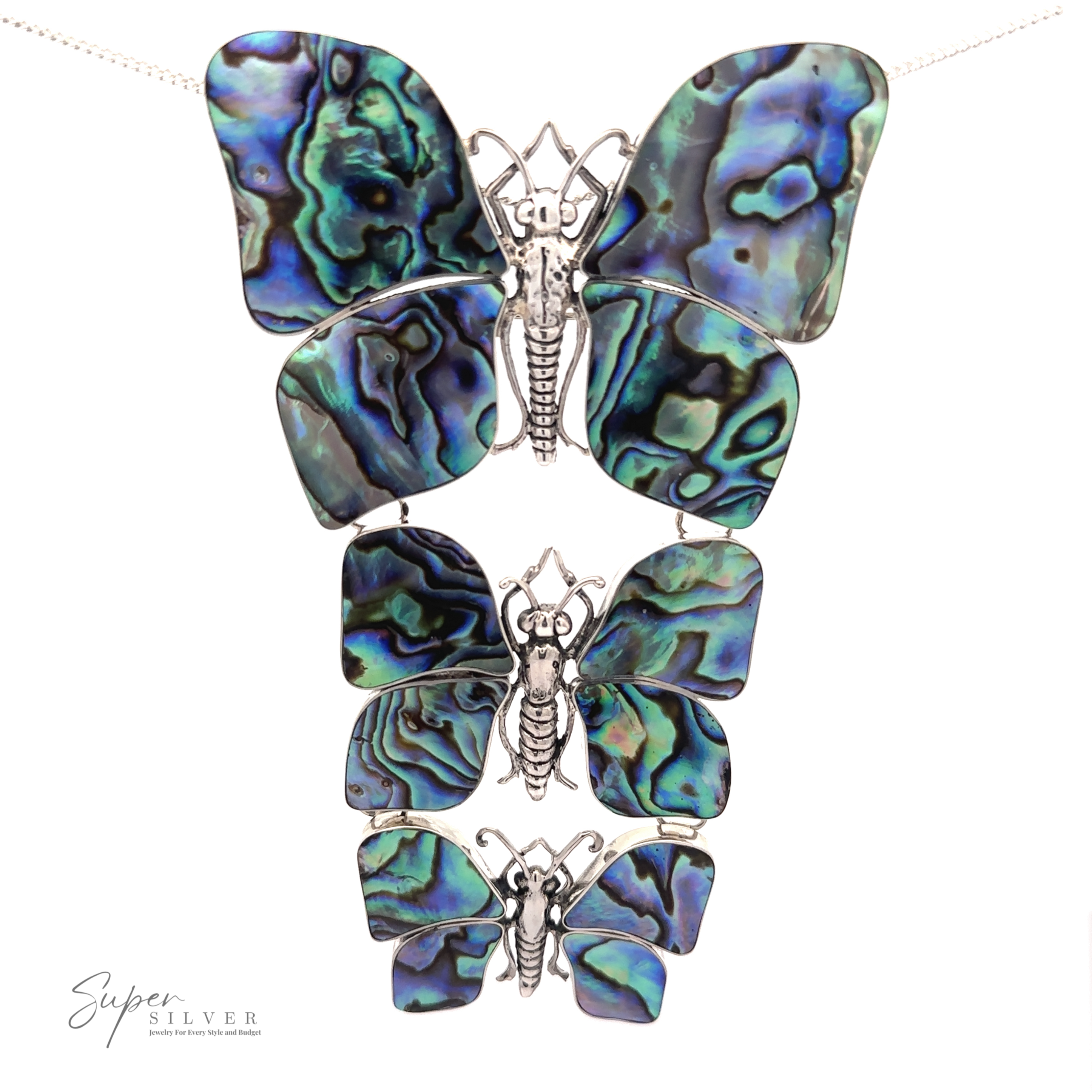 A stunning Statement Pendant or Brooch with Three Butterflies featuring three butterfly pendants with abalone shell wings, each meticulously crafted with detailed sterling silver bodies and antennae, perfect for any nature lover. Displayed on a white background.