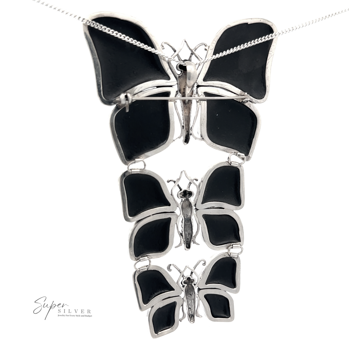 
                  
                    Statement Pendant or Brooch with Three Butterflies featuring a pendant of three cascading black enamel butterfly pendants on a delicate sterling silver chain, perfect for the nature lover.
                  
                