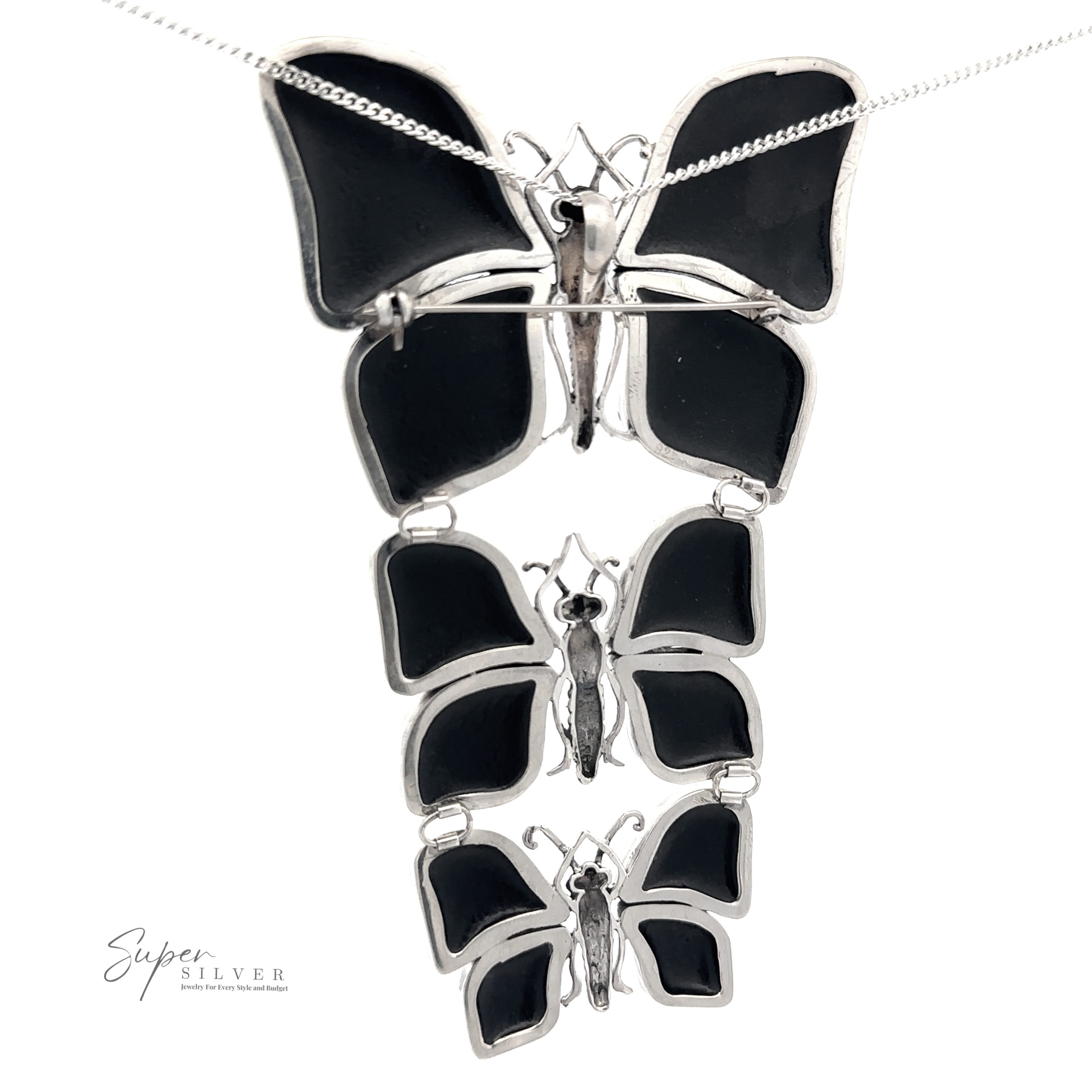 Statement Pendant or Brooch with Three Butterflies featuring a pendant of three cascading black enamel butterfly pendants on a delicate sterling silver chain, perfect for the nature lover.