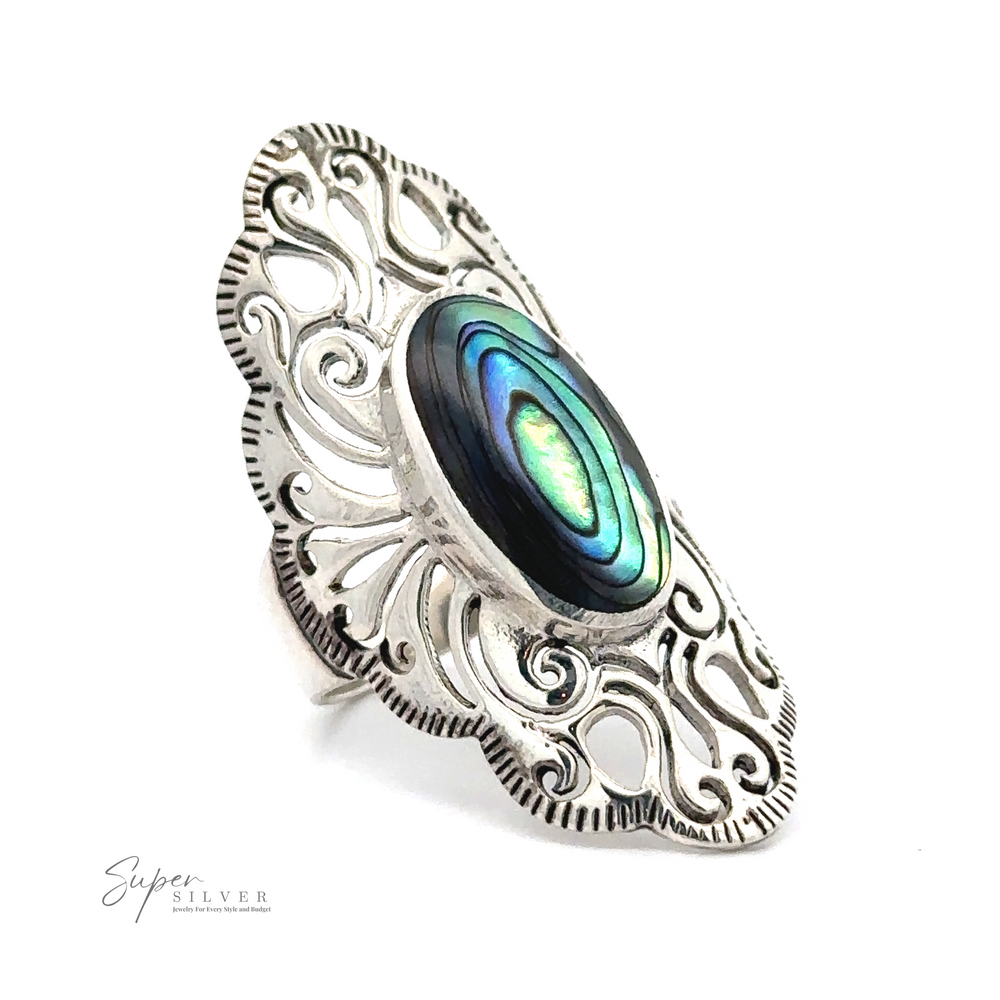 
                  
                    A standout piece of jewelry, this Long Vintage-Inspired Filigree Ring With Inlaid Stone boasts a silver band with intricate filigree design, featuring an oval abalone shell centerpiece that exudes vintage charm.
                  
                