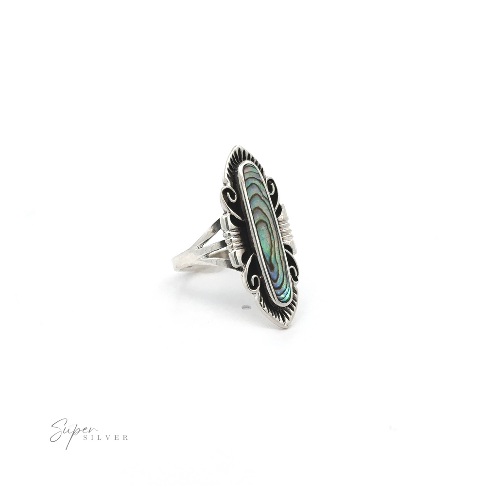 
                  
                    An Elegant Southwest Inspired Ring with Inlaid Stone featuring an inlaid abalone stone.
                  
                
